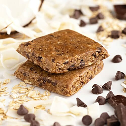 Two chocolate chip oat bars with scattered chocolate chips and oats.